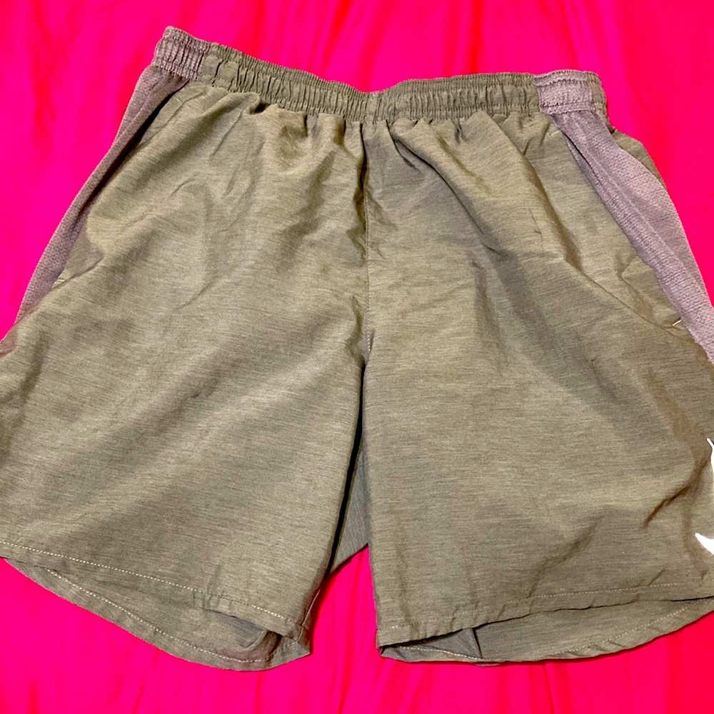 Nike grey Dri Fit shorts with back pocket for athleisure activities. Size small.